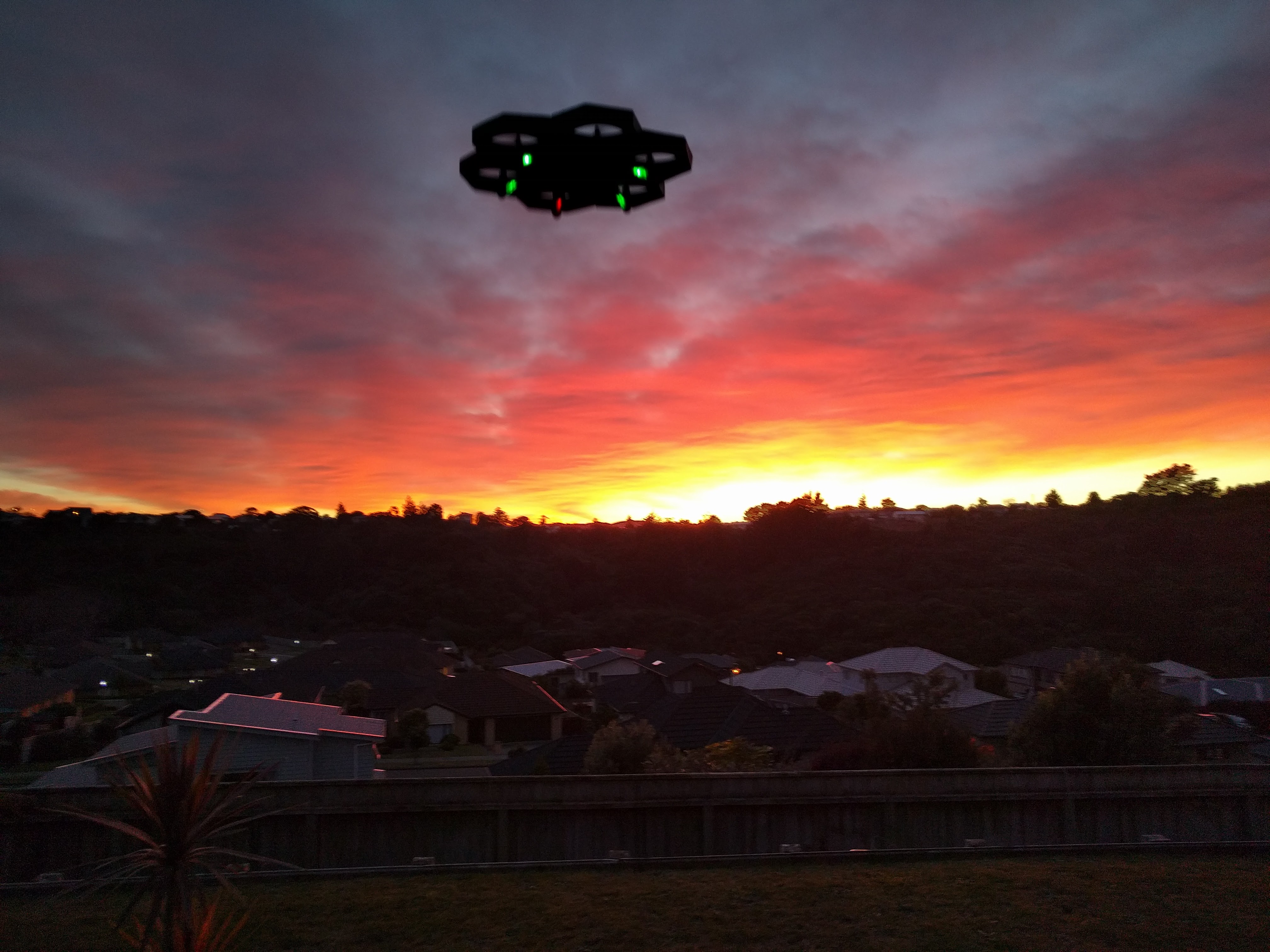 Drone flying in the sunrise